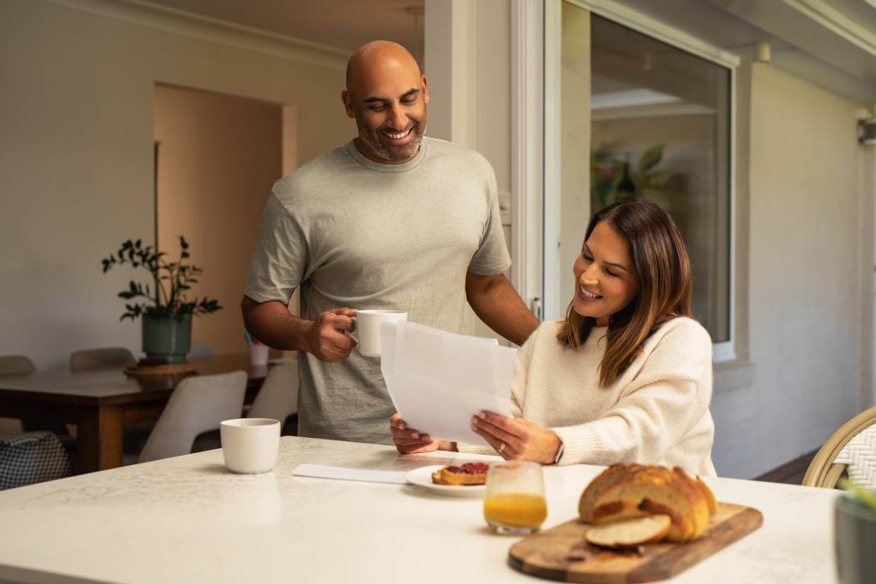 Couple reading bill at dinner table